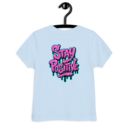 Hellblaues Kinder T-Shirt mit pinkem"Stay positive" Graffiti